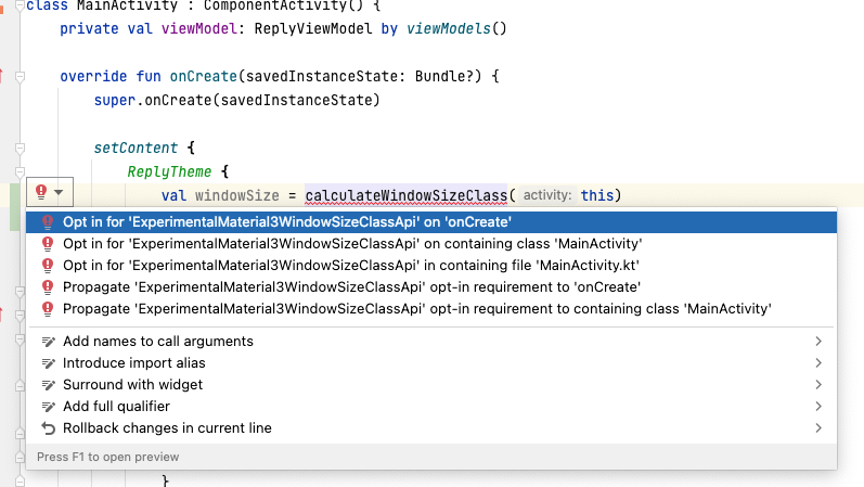 在代码中，“val windowSize = calculateWindowSizeClass(this)”一行处于选中状态，代码行的左侧显示了红色灯泡图标。选中的灯泡下方是一系列用于修正错误的选项，其中“Opt in for 'ExperimentalMaterial3WindowSizeClassApi' on 'onCreate'”处于选中状态。